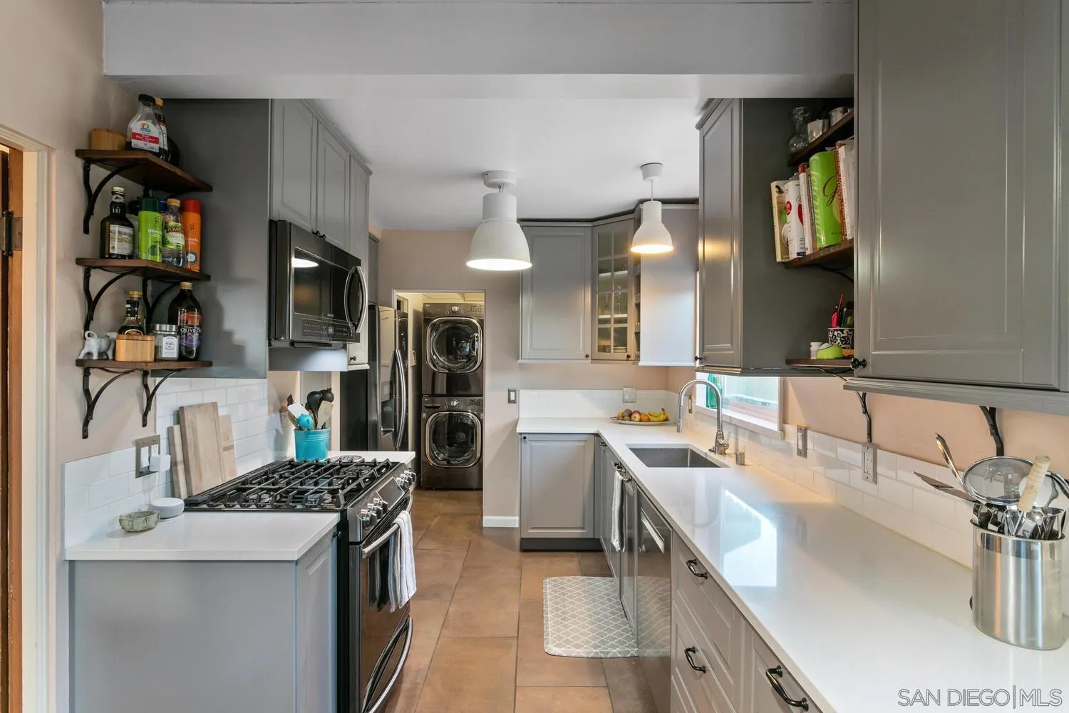 3443 Freeman Street San Diego, CA 92106 - Photo 7 of 35 a kitchen with a sink stove and cabinets