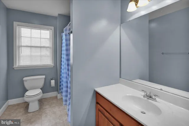 a view of a room with wooden floor and windows