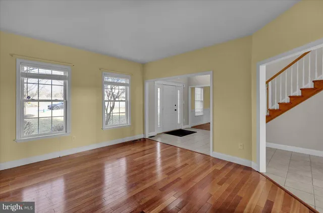 a bathroom with a toilet sink vanity and mirror