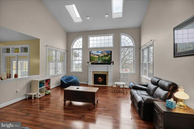 a bathroom with a toilet a sink and a mirror