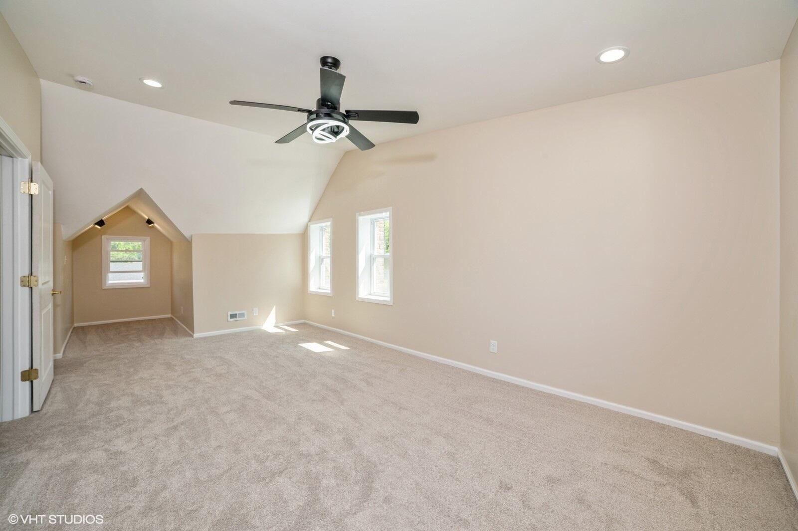 933 East 44th Place Gary, IN 46409 - Photo 17 of 28 an empty room with a window and a ceiling fan
