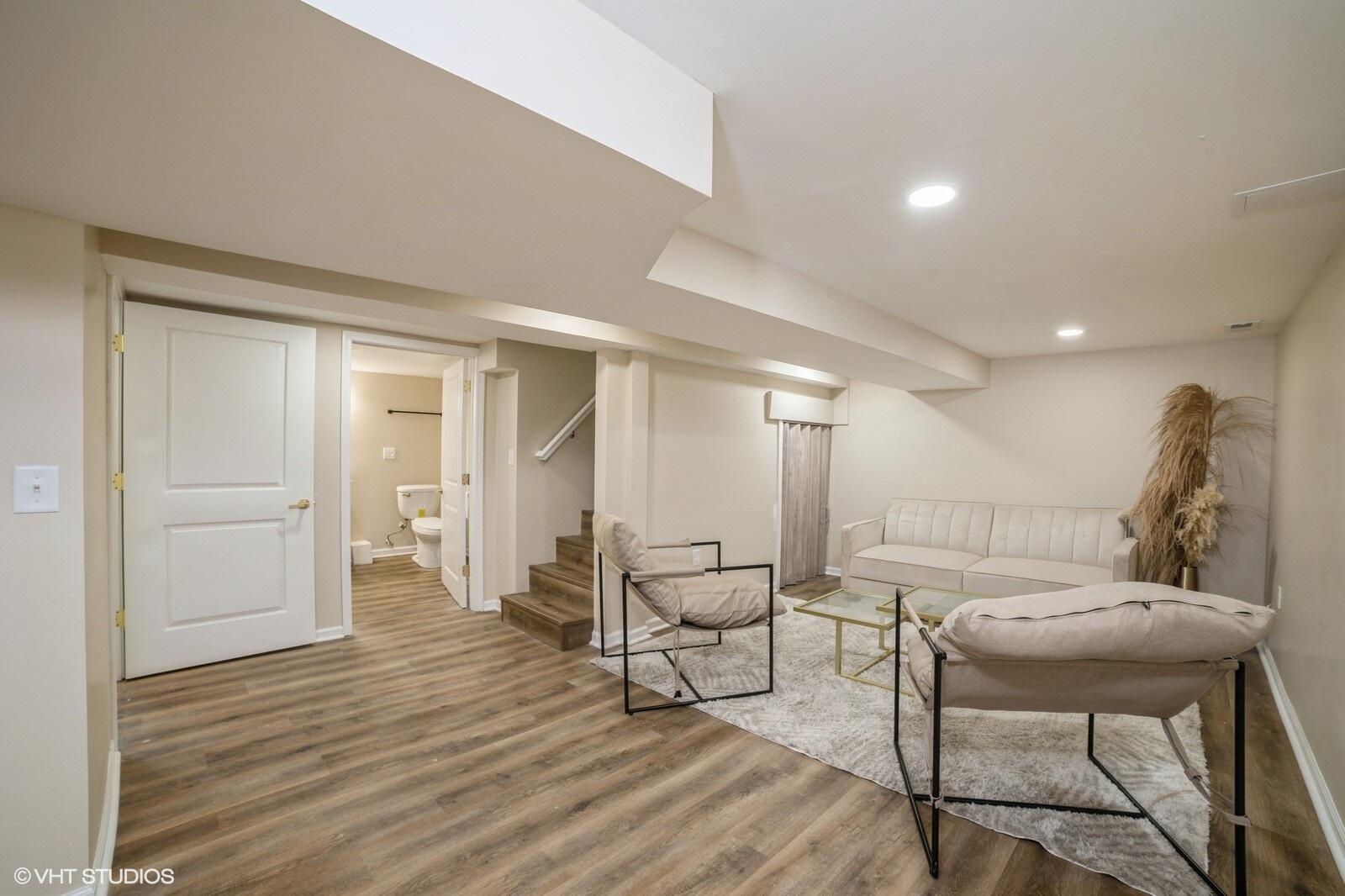 933 East 44th Place Gary, IN 46409 - Photo 19 of 28 a living room with furniture and a wooden floor