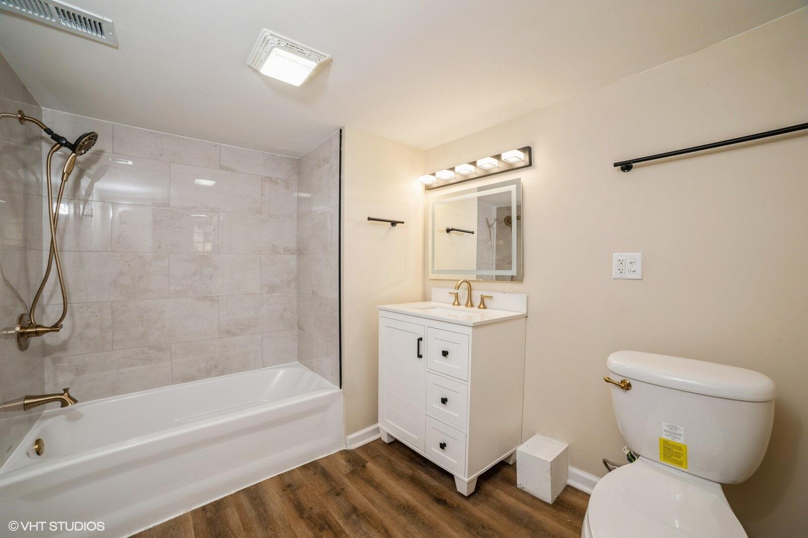 933 East 44th Place Gary, IN 46409 - Photo 23 of 28 a bathroom with a sink a toilet and shower