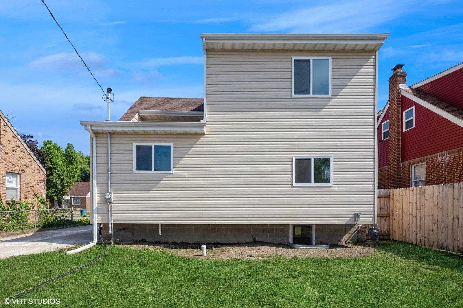 933 East 44th Place Gary, IN 46409 - Photo 26 of 28 a view of backyard with a garden and deck