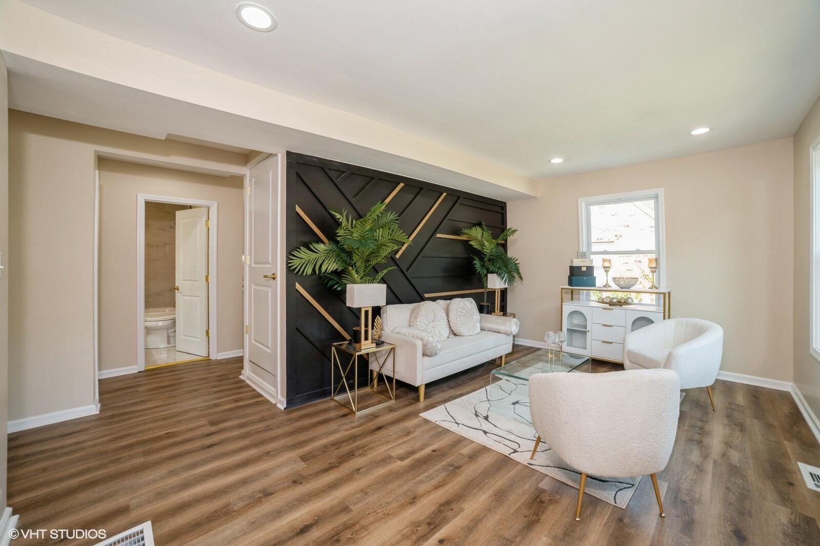 933 East 44th Place Gary, IN 46409 - Photo 4 of 28 a living room with furniture and a flat screen tv
