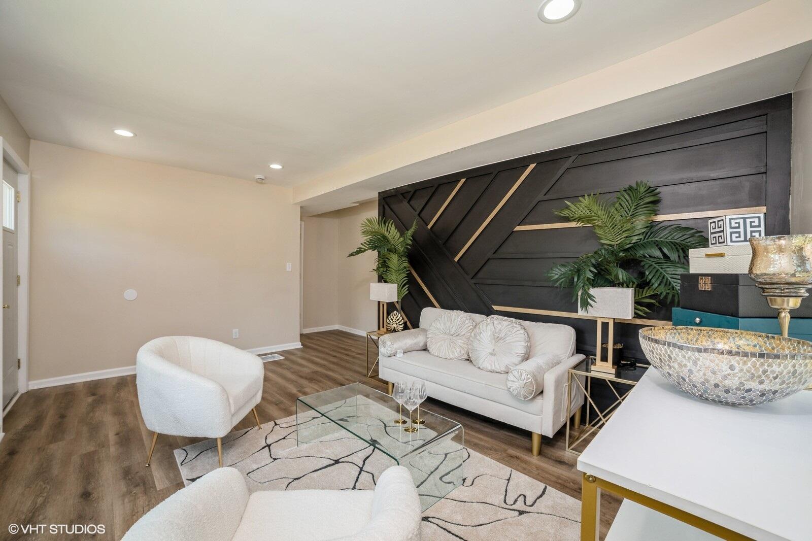 933 East 44th Place Gary, IN 46409 - Photo 6 of 28 a living room with furniture and a potted plant