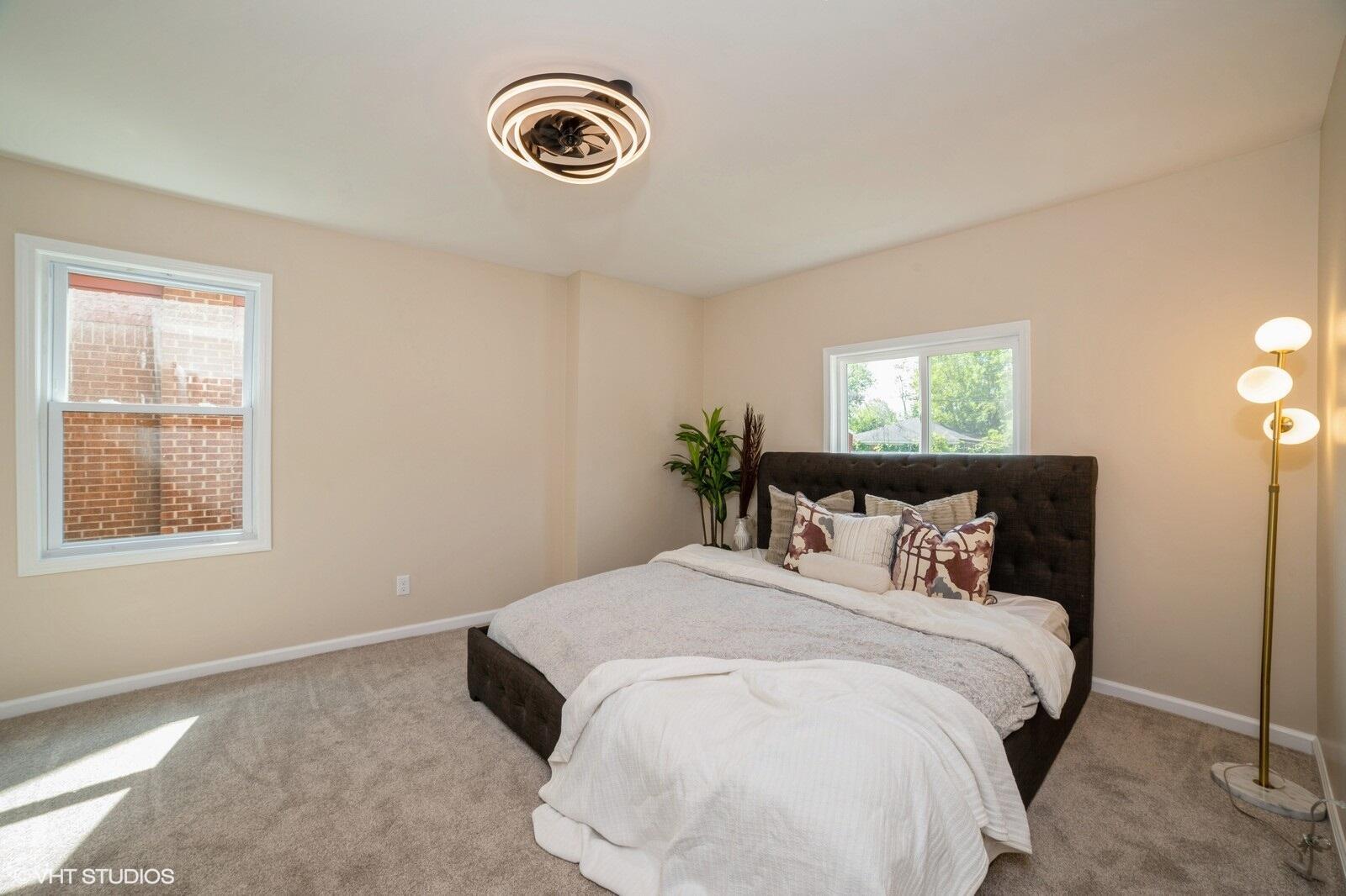 933 East 44th Place Gary, IN 46409 - Photo 8 of 28 a bedroom with a bed and a window