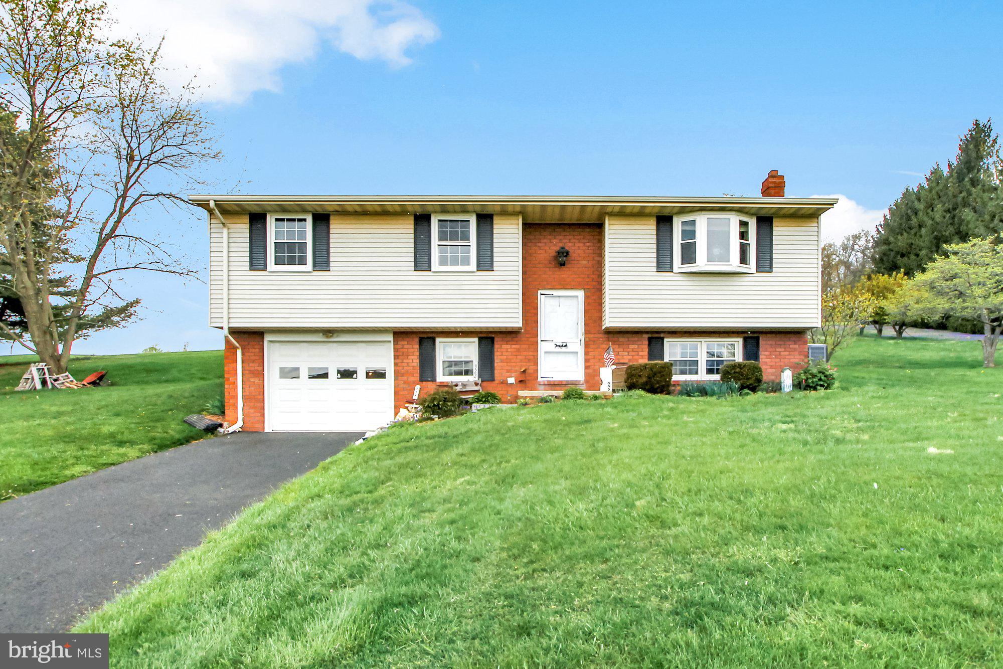 922 Hobart Road Hanover, PA 17331 - Photo 1 of 28 a front view of a house with a garden