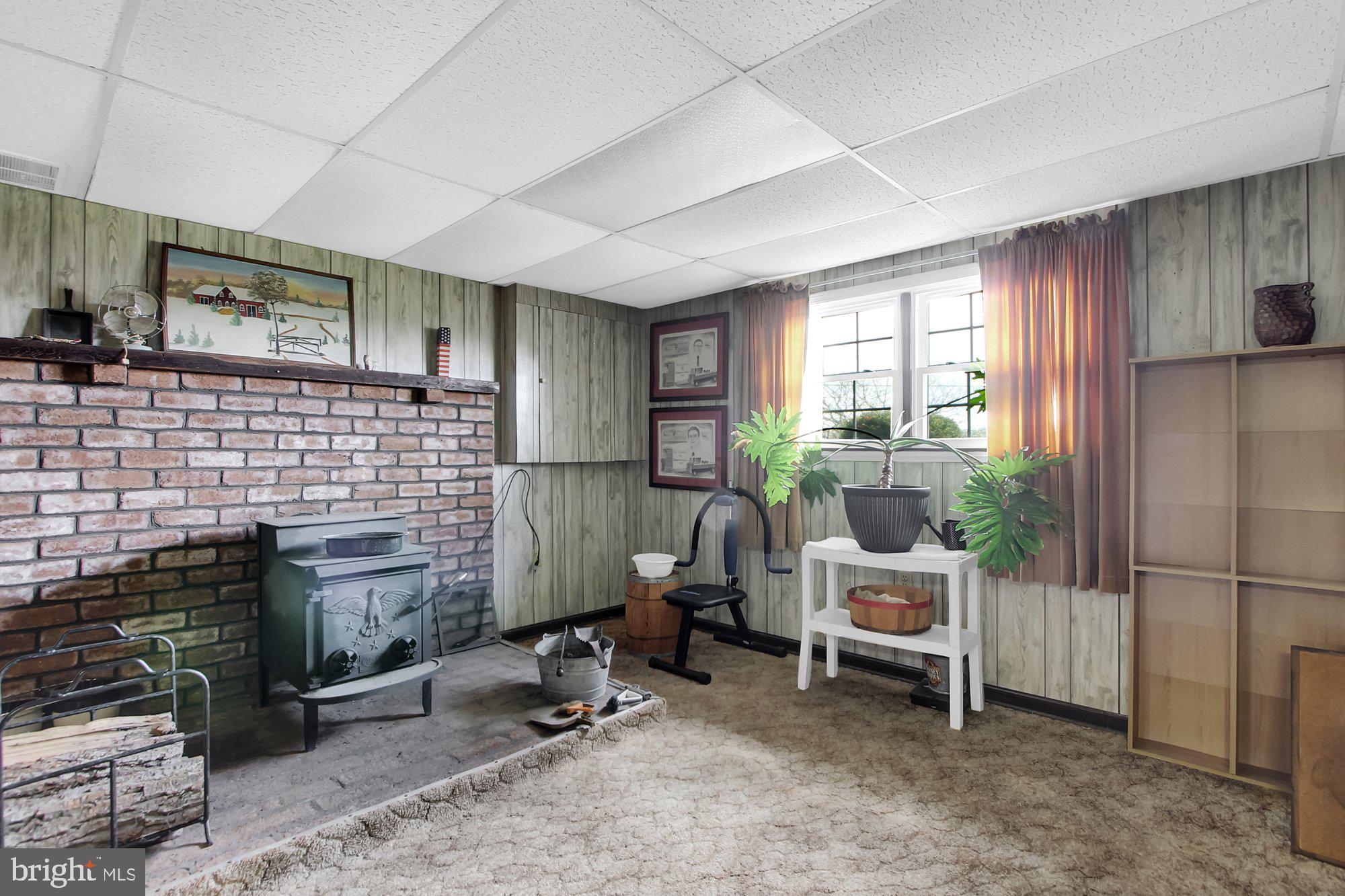 922 Hobart Road Hanover, PA 17331 - Photo 19 of 28 a living room with furniture a window and a fireplace