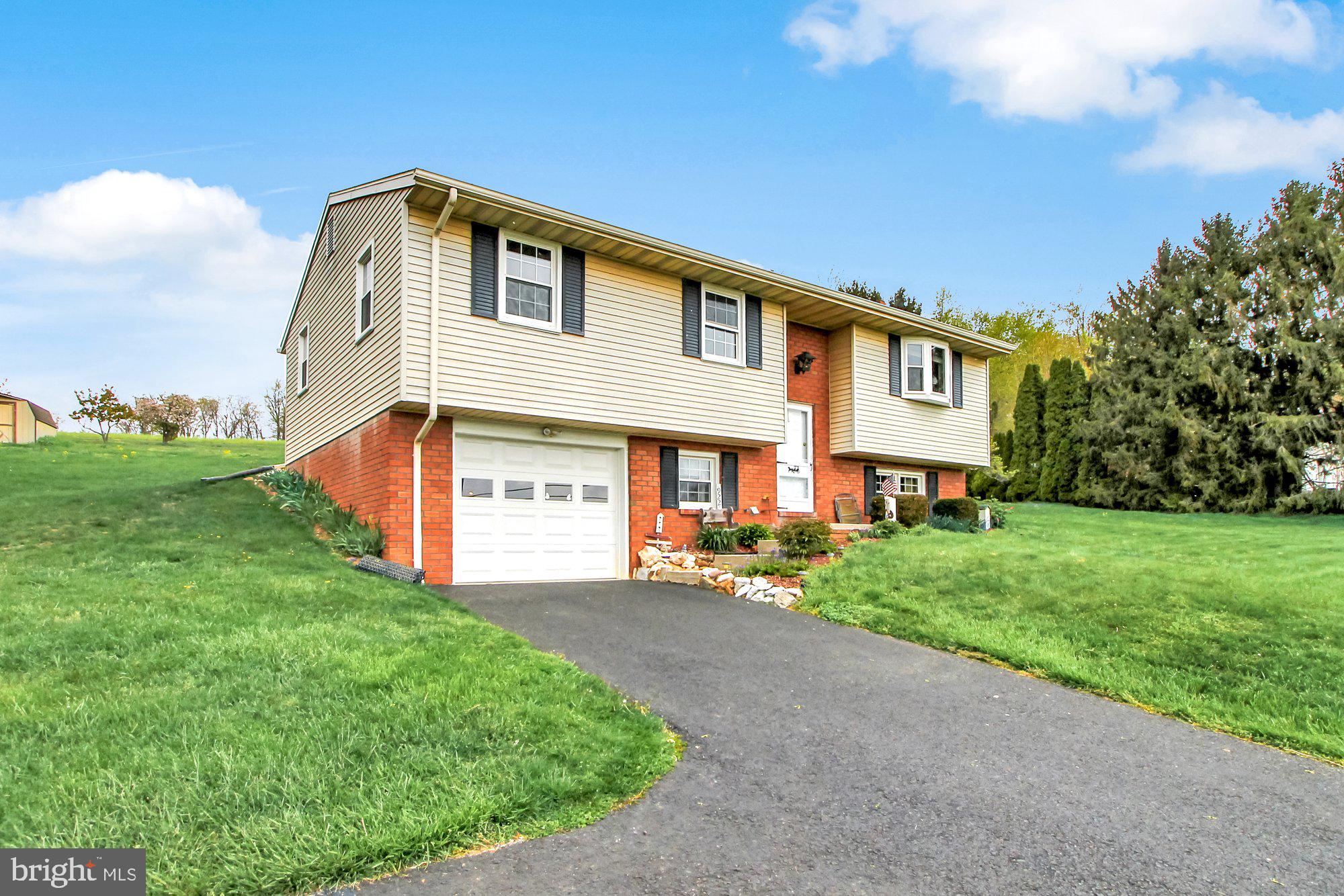 922 Hobart Road Hanover, PA 17331 - Photo 3 of 28 a front view of a house with a yard and garage