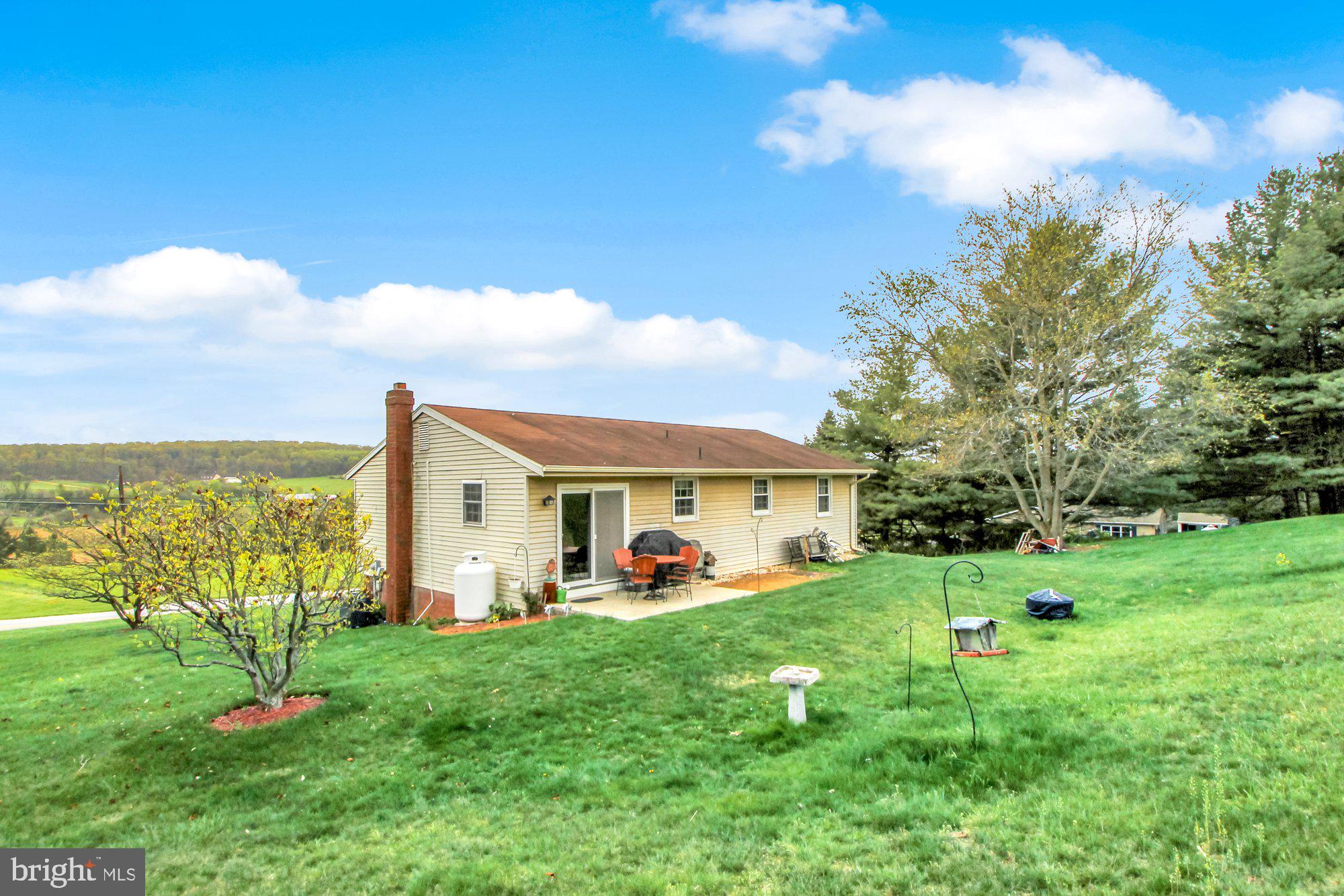922 Hobart Road Hanover, PA 17331 - Photo 24 of 28 a view of a house with a big yard and potted plants