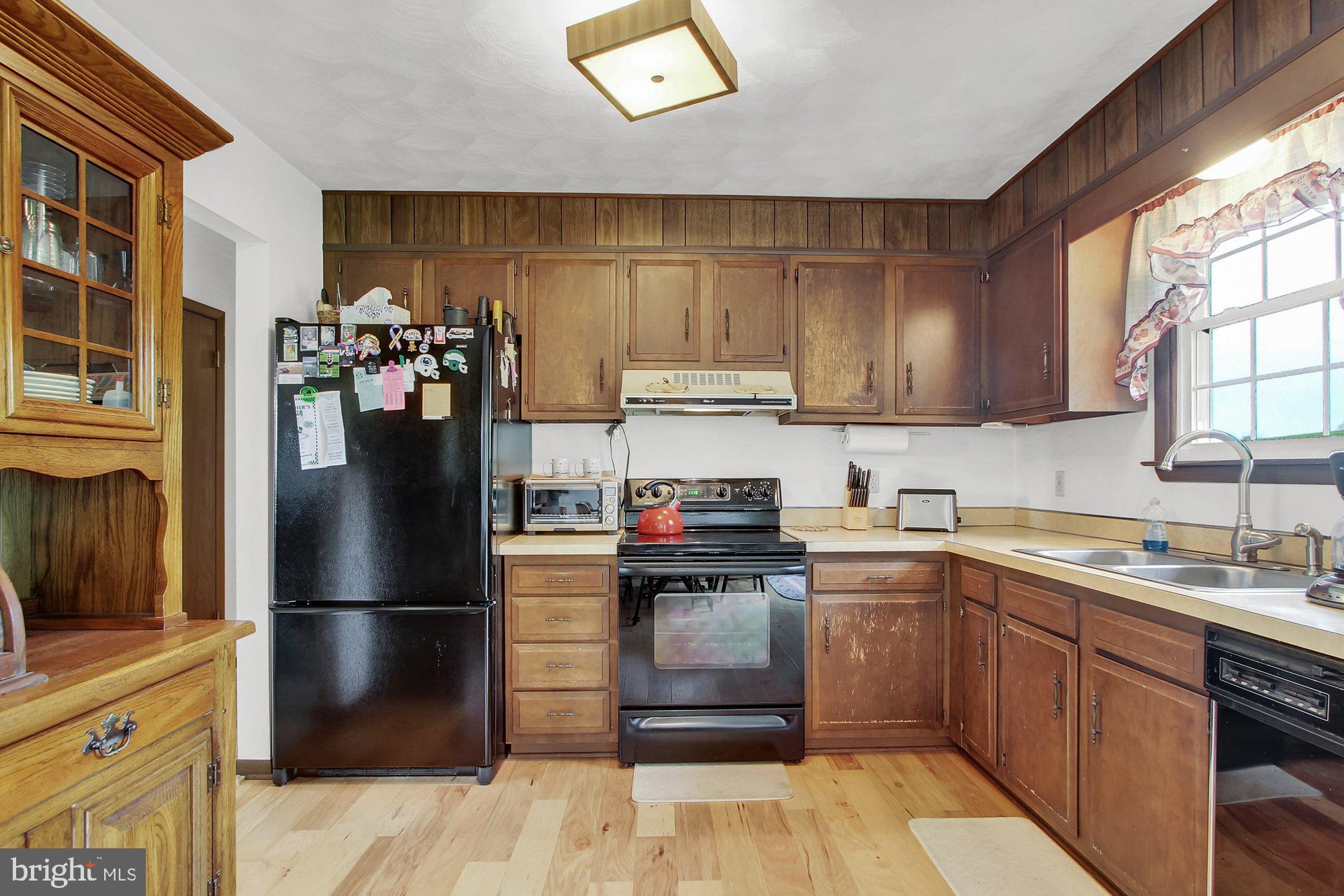 922 Hobart Road Hanover, PA 17331 - Photo 10 of 28 a kitchen with a refrigerator sink and cabinets