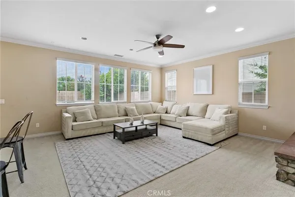 a living room with furniture and a large window