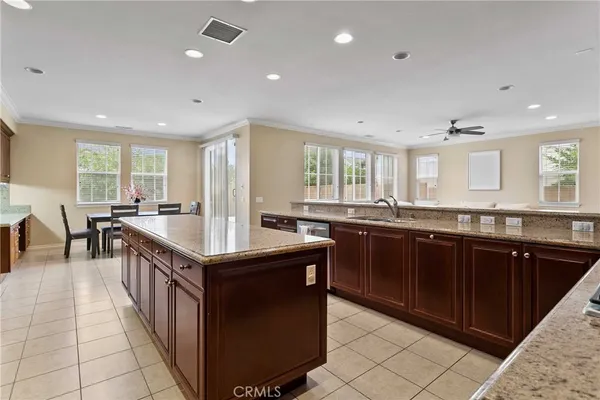 a kitchen with granite countertop a sink and a stove