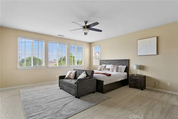 a bedroom with bed and window