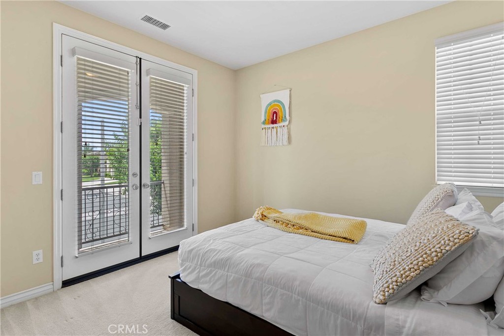 14496 Meadow Brook Eastvale, CA 92880 - Photo 19 of 33 a bedroom with a bed and a window