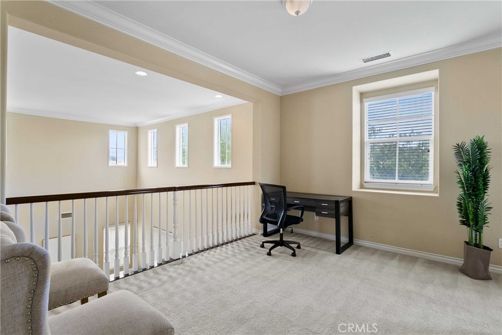 14496 Meadow Brook Eastvale, CA 92880 - Photo 26 of 33 a view of a livingroom with workspace and a window