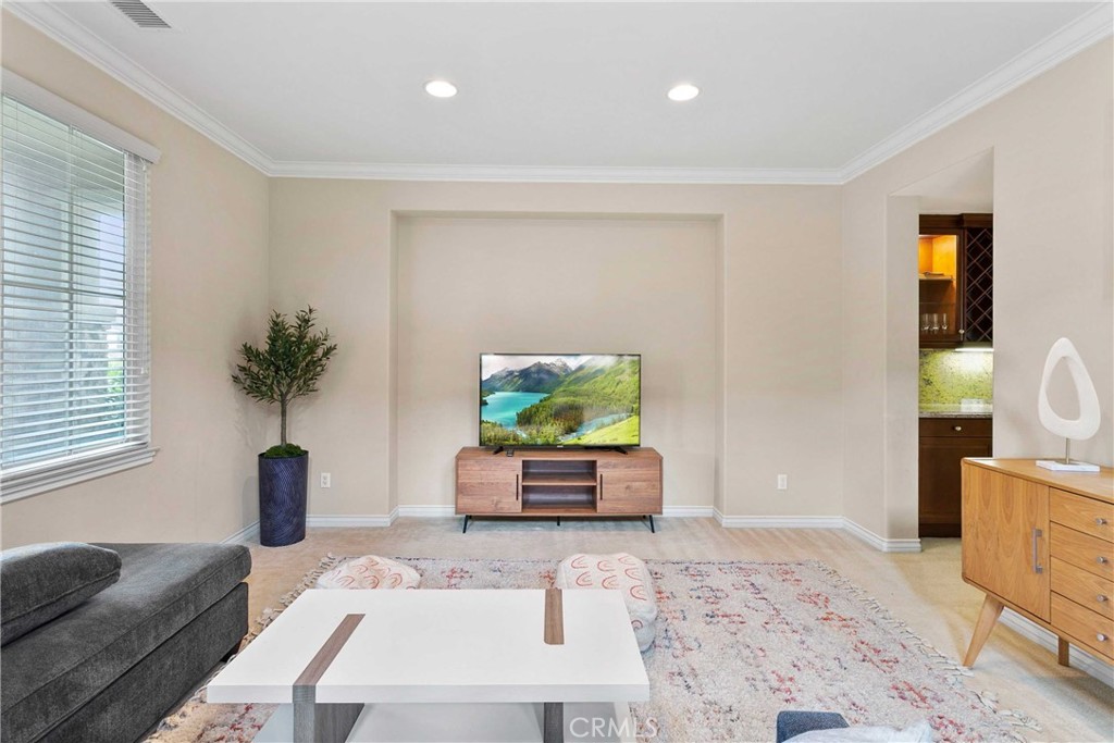 14496 Meadow Brook Eastvale, CA 92880 - Photo 4 of 33 a living room with furniture and a flat screen tv