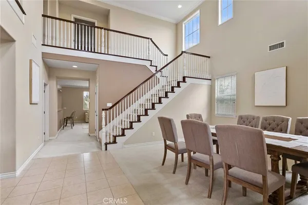 a view of entryway and hall with dining room