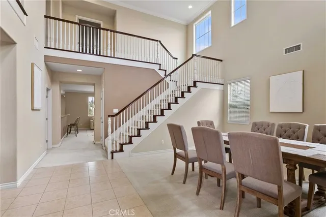 a view of entryway and hall with dining room