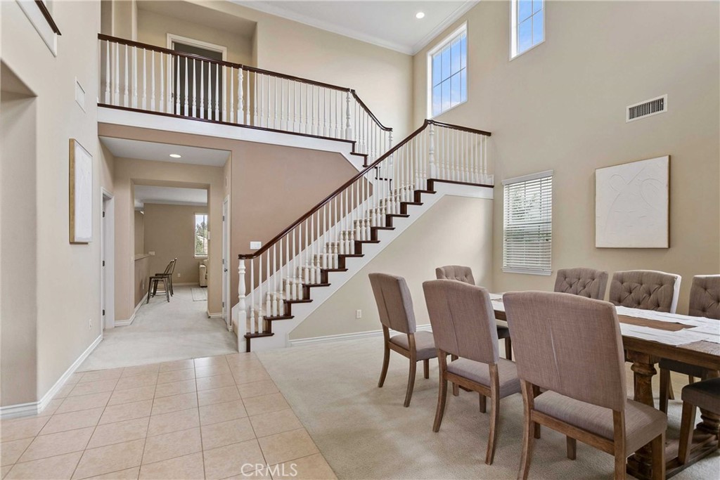 14496 Meadow Brook Eastvale, CA 92880 - Photo 7 of 33 a view of entryway and hall with dining room