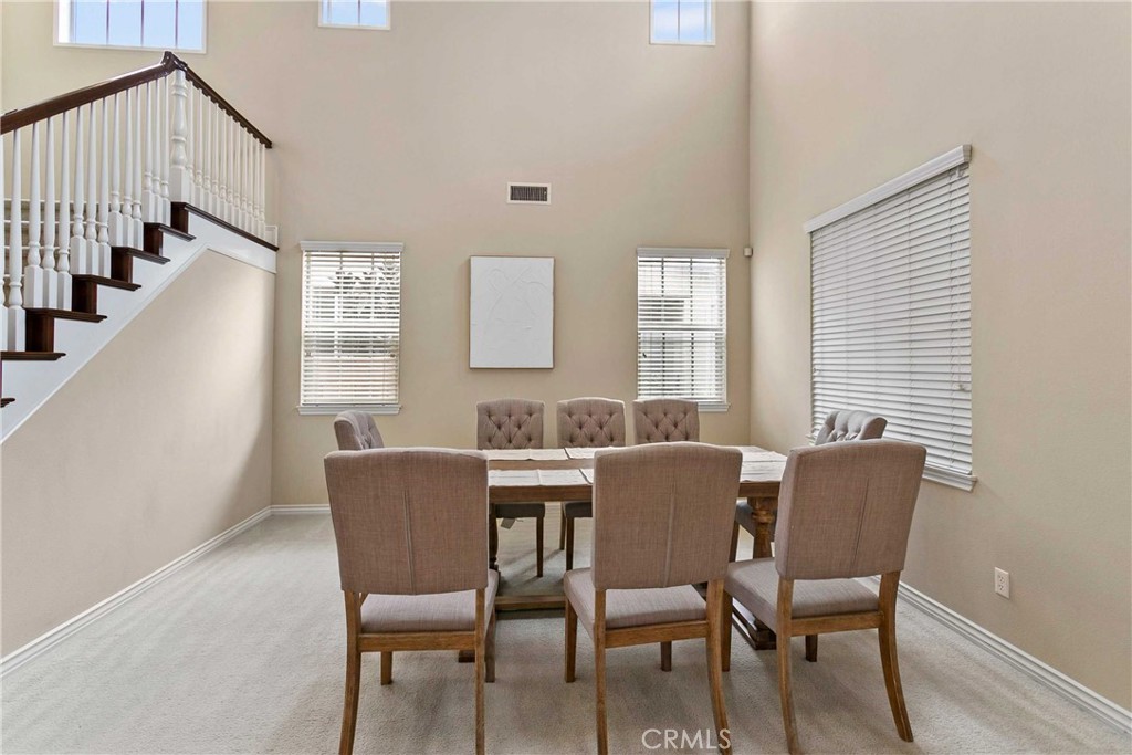 14496 Meadow Brook Eastvale, CA 92880 - Photo 8 of 33 a view of a dining room with furniture and windows