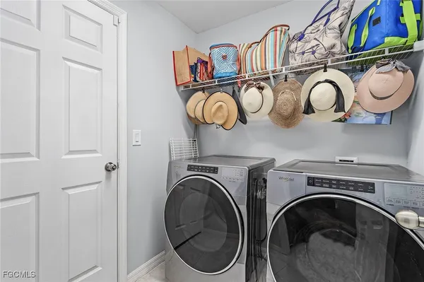 a view of a storage and utility room with racks on the wall