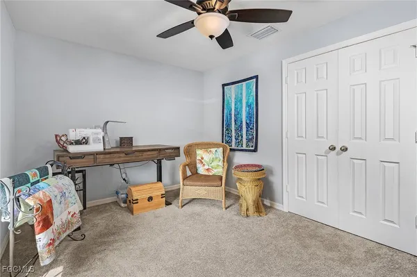 a bedroom with furniture and a window