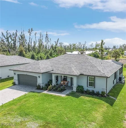 a aerial view of a yard in front of the house