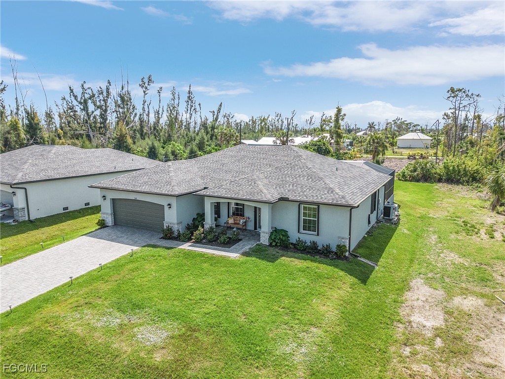 3505 Mango Street St. James City, FL 33956 - Photo 26 of 32 a house view with a garden space