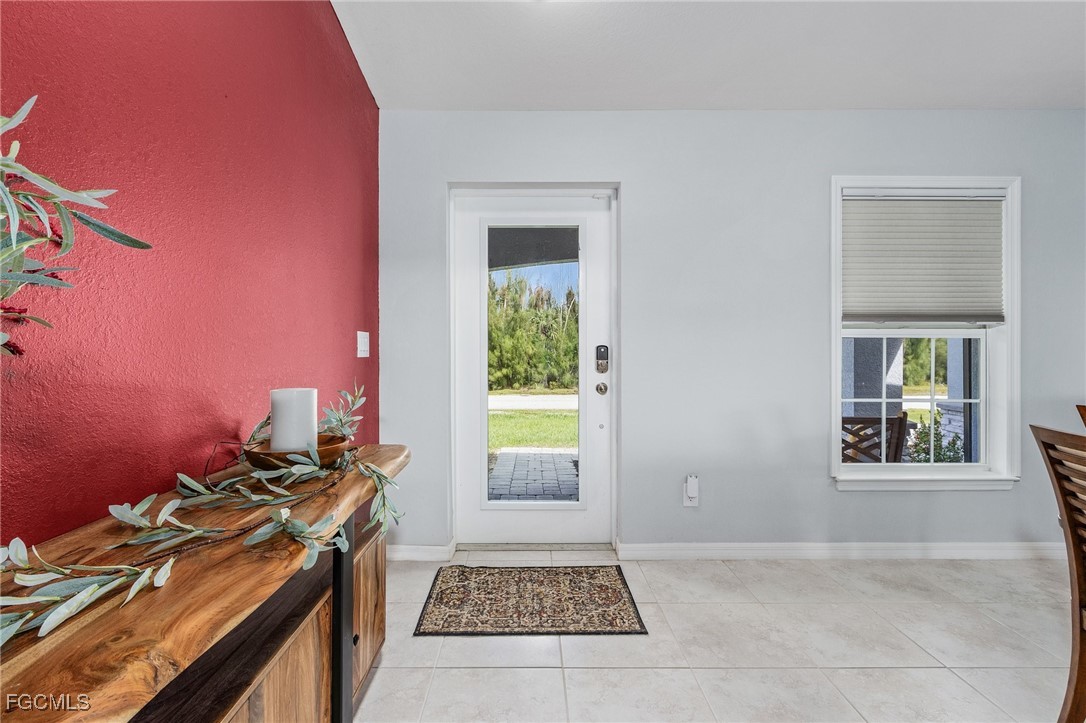 3505 Mango Street St. James City, FL 33956 - Photo 5 of 32 a kitchen with a stove and a window