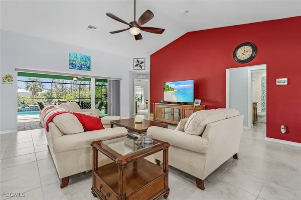 a living room with patio couch and a large window