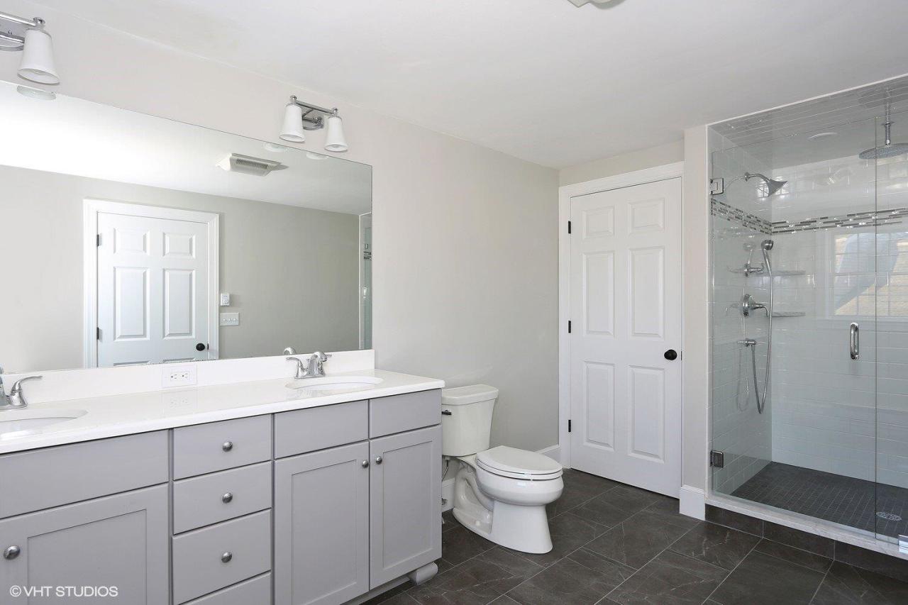 19 Salten Point Road Barnstable, MA 02630 - Photo 11 of 23 a spacious bathroom with a double vanity sink toilet and shower