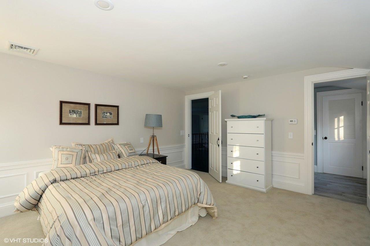 19 Salten Point Road Barnstable, MA 02630 - Photo 16 of 23 a bedroom with a bed and a walk in closet