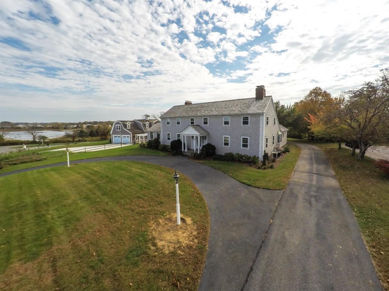 19 Salten Point Road Barnstable, MA 02630 - Photo 21 of 23 a view of a house with a yard