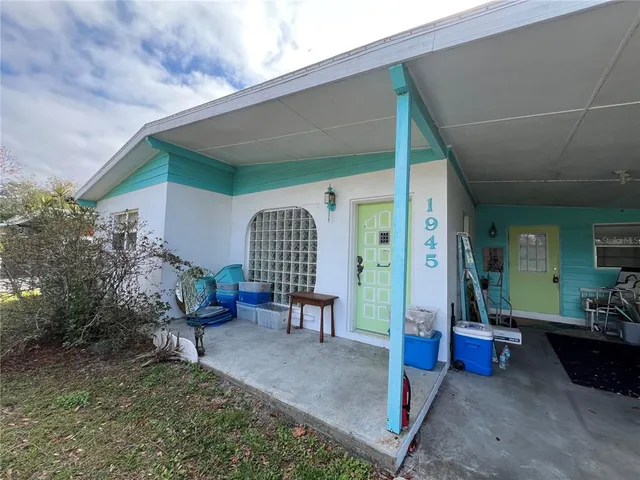 a view of living room filled with furniture and a potted plant