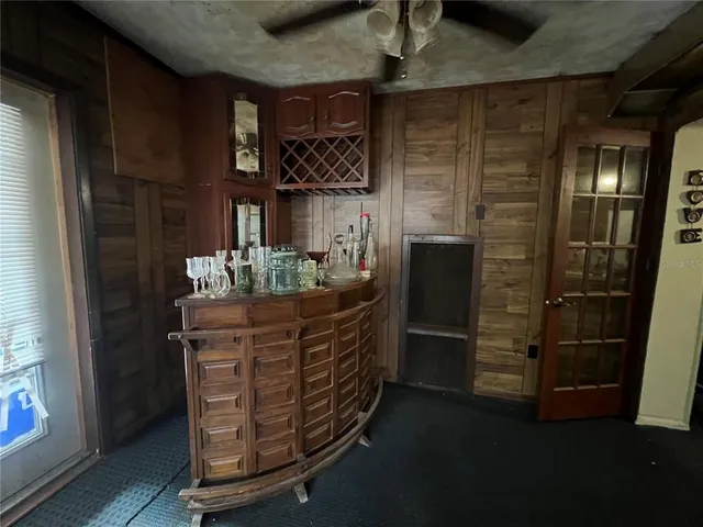 a kitchen with a sink appliances and cabinets