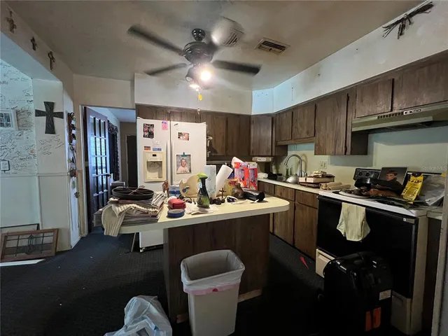 a view of a entryway door with wooden floor