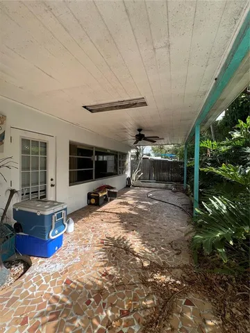 a view of a backyard with sitting area