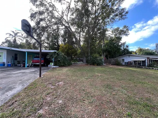 a view of a house with a back yard