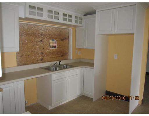 898 Southwest 15th Street Boca Raton, FL 33486 - Photo 5 of 16 a bathroom with a sink and a mirror