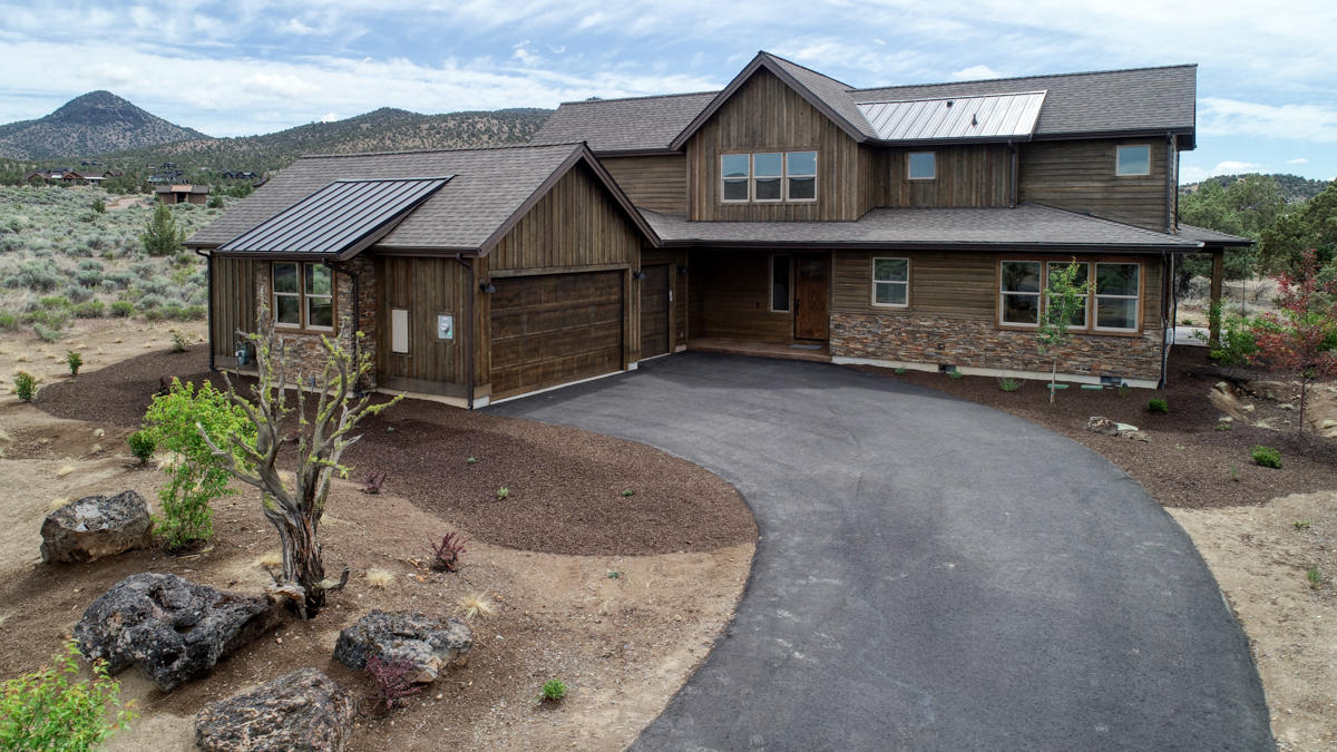 15751 South W Brasada Ranch Road, Unit LOT 363 Powell Butte, OR 97753 - Photo 1 of 47 a view of a house with a yard and sitting area