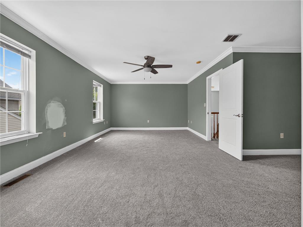 3821 Rittenhouse Road Lower Macungie Township, PA 18062 - Photo 45 of 62 A spacious room offers ample natural light and plush carpeting, perfect for a peaceful retreat.