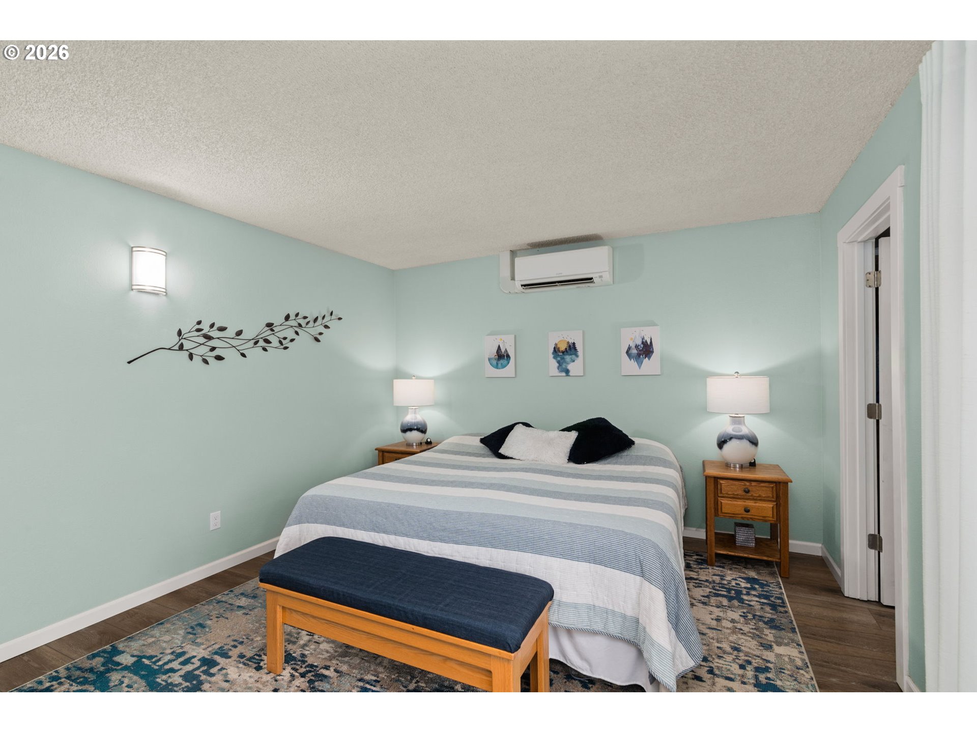 1200 Northeast Territorial Road, Unit 12 Canby, OR 97013 - Photo 26 of 38 a bedroom with a bed and a lamp on the dresser