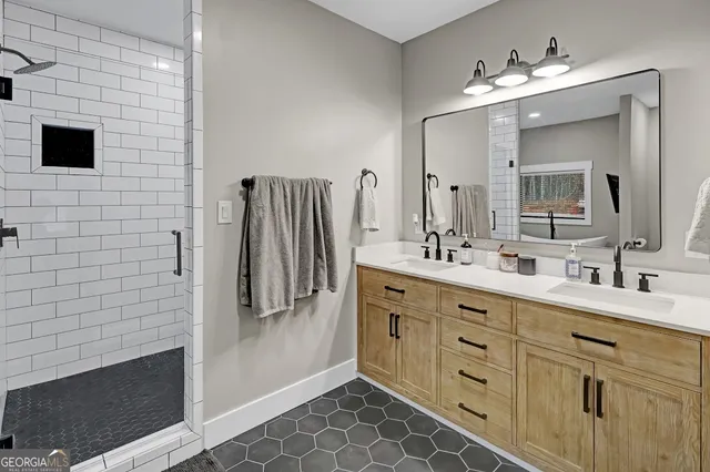 a bathroom with a shower and a sink