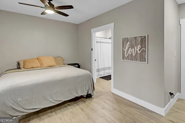 a bathroom with a toilet a sink and a mirror