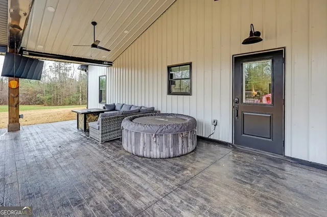 a backyard of a house with table and chairs