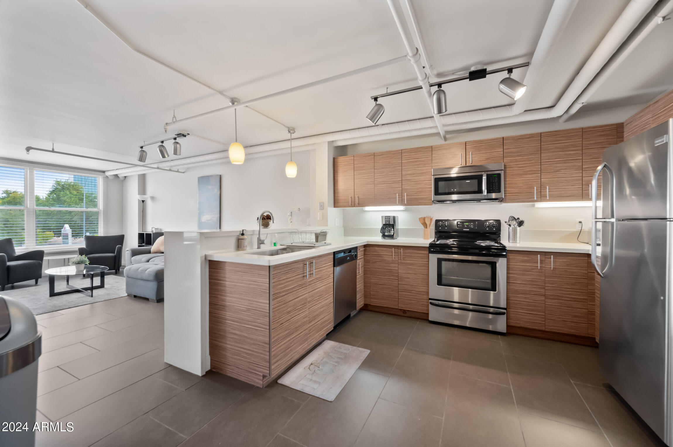535 West Thomas Road, Unit 212 Phoenix, AZ 85013 - Photo 5 of 18 a kitchen with appliances cabinets and a sink
