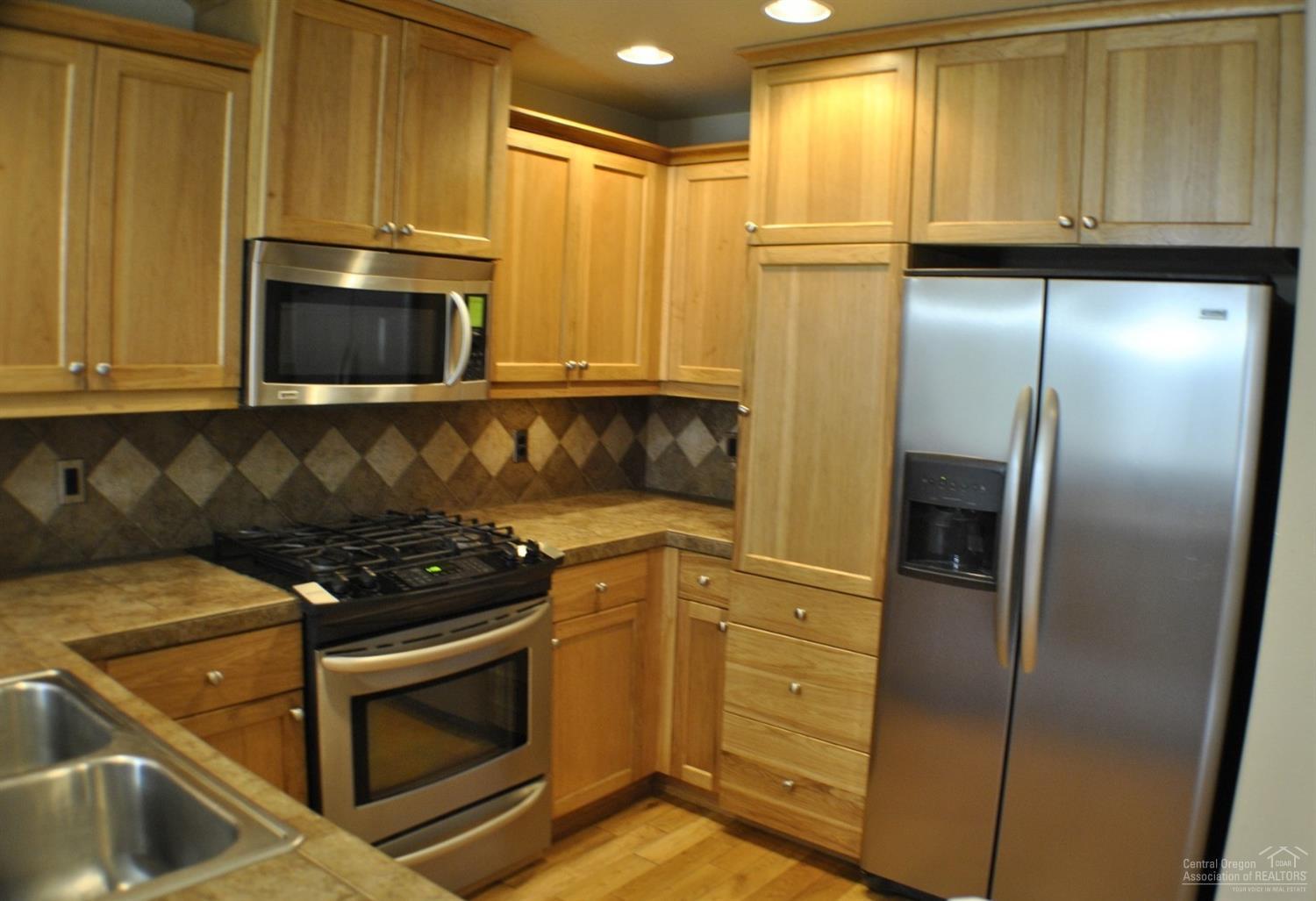 20249 Schaeffer Drive Bend, OR 97703 - Photo 1 of 11 Bright kitchen with S/S appliances, tile