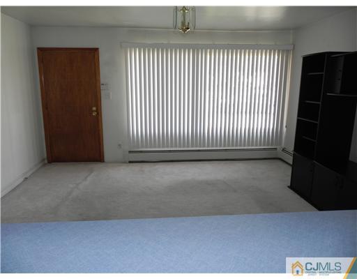 3 Sturgis Road Edison, NJ 08817 - Photo 2 of 17 an empty room with windows